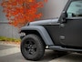 Jeep Wrangler 3.8i Sport Automaat | XRC Bumpers | Mopar Zijschermen | Rollcage | LED | Afneembaar Dak | Custom Uitlaat | Apple Carplay | 4-Zits | Offroadbanden | Hardtop