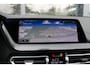 BMW 1-Serie M135i xDrive High Executive PANO HUD CAMERA LEER