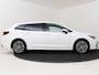 Toyota Corolla Touring Sports Hybrid 180 Business Plus *DEMO* | Parkeersensoren V+A | Half lederen bekleding | Parelmoer lak | Stoelverwarming |