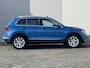 Volkswagen Tiguan 1.4 TSI ACT Highline / Inklapbare Trekhaak (Trekgewicht 1.800kg) / Elektrisch Glazen Schuif- en Kanteldak / 360º Camera / Apple Carplay & Android Auto / Adaptieve Cruise Control / Climate Control / Navigatie full map / Elektrisch Verstelbare Bestuurdersstoel met geheugenset / Keyless Entry & Start / Elektrische Achterklep / Verwarmde Voorstoelen /