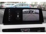 BMW X1 sDrive18i High Exe. M Sport / Trekhaak / Half leder / Navi. Proff / Parkeerhulp V+a / 18'' / Stoelverwarming / DAB / Cruise Control