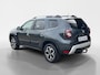 Dacia Duster 130PK TCe Prestige | Trekhaak (1500 KG) | Navi | Camera | Apple CarPlay/Android Auto | Armsteun | Cruise Control | Airco | Lichtmetalen Velgen |