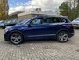 Volkswagen Tiguan 2.0 TDI Highline 150 PK DSG | Automaat | R-Line Exterieur | Trekhaak | Panoramadak | Elektrische Achterklep | Digital Cockpit Pro | Achteruitrijcamera | Stoelverwarming | Navigatie | Climate Control | Park Assist | Adaptive Cruise Control | Grootlicht Assistent | Parkeersensoren | DAB Radio | Bluetooth |