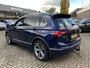 Volkswagen Tiguan 2.0 TDI Highline 150 PK DSG | Automaat | R-Line Exterieur | Trekhaak | Panoramadak | Elektrische Achterklep | Digital Cockpit Pro | Achteruitrijcamera | Stoelverwarming | Navigatie | Climate Control | Park Assist | Adaptive Cruise Control | Grootlicht Assistent | Parkeersensoren | DAB Radio | Bluetooth |
