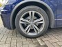 Volkswagen Tiguan 2.0 TDI Highline 150 PK DSG | Automaat | R-Line Exterieur | Trekhaak | Panoramadak | Elektrische Achterklep | Digital Cockpit Pro | Achteruitrijcamera | Stoelverwarming | Navigatie | Climate Control | Park Assist | Adaptive Cruise Control | Grootlicht Assistent | Parkeersensoren | DAB Radio | Bluetooth |