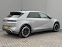 Hyundai Ioniq 5 Lounge AWD 77.4 kWh Automaat / Accu SOH 100% / Trekgewicht 1600 Kg / Fabrieksgarantie tot 02-2029 / HUD / Panoramadak / Apple Carplay Android Auto / Stuur-, Stoel en Achterbank verwarming / Bose Audio Systeem /