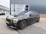 BMW 1-Serie M140i xDrive Edition Shadow High Executive OPEN DAK | ACHTERUIT RIJ CAMERA | NAVIGATIE | SFEERVERLICHTING | HARMANKARDON | F1 STUUR | LEDER | ELEKTRISCHE STOELEN MEMORY |