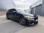 BMW 1-Serie M140i xDrive Edition Shadow High Executive OPEN DAK | ACHTERUIT RIJ CAMERA | NAVIGATIE | SFEERVERLICHTING | HARMANKARDON | F1 STUUR | LEDER | ELEKTRISCHE STOELEN MEMORY |