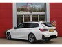 BMW 3-Serie Touring 330e 292PK M-SPORT | PANORAMISCH SCHUIF/KANTEL DAK | M-SPORT PRO-PAKKET | M-SPORT REMMEN UITGEVOERD IN DONKERBLAUW MET M LOGO | BMW LIVE COCKPIT PROFESSIONAL | CURVED DISPLAY |DRIVING ASSISTANT INCL. HEAD-UP DISPLAY | PARKING ASSIST INCL. ACHTERUITRIJCAMERA | ADAPTIEVE LED KOPLAMPEN |SHADOW LINE | M-SPORTSTOELEN VOOR | LEDER VERNASCA MET CONTRAST STIKSELS M-SPORT | STOEL VERWARMING | DRAADLOZE APPLE CARPLAY | ELEKTRISCH VERSTELBARE STOELEN MET GEHEUGEN FUNCTIE | HEAD UP DISPLAY | DRAADLOZE TELEFOONLADER | DODEHOEK BEWAKING | COMFORT PACK INCL. ELEKTRISCHE ACHTERKLEP | ADAPTIVE CRUISE CONTROL | HIFI AUDIO DAB+ RADIO | COMFORT ACCESS (KEYLESS ENTRY)| DONKER GETINTE ACHTERRUITEN |