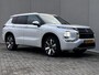 Mitsubishi Outlander 2.4 PHEV Instyle AWD 306 pk Automaat / Fabrieksgarantie tot 04-2033 / Panorama schuifdak / 1.600 kg trekgewicht / HUD / Camera 360° / Elektrische stoelen en klep / Stuur-, stoel- en achterbankverwarming / Leder / 20"LM wielen /