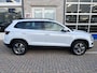 Skoda Karoq 1.0 TSI Ambition / ELEKTR. TREKHAAK/ KEYLESS/ SMARTLINK/ PARK. SENSOREN + CAMERA/ NAVI/ SPRAAKBEDIENING/ CLIMA/ STOEL-STUUR VERWARM.