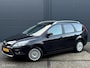 Ford Focus Wagon 1.8 Limited Flexi Fuel - ECC - NAVI - CRUISE CONTROLE - BLUETOOTH - VERWARMDE VOORRUIT - PDC - LM VELGEN - GETINT GLAS - NAP - NL AUTO - APK T/M 05-05-2026 -