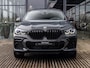 BMW X6 M50i High Executive | NL GELEVERDE AUTO | 1E EIGENAAR | 22 INCH | DRAVITGRAU | LASER | PANORAMA/SCHUIF-KANTELDAK | CARBON INTERIEURLIJSTEN | STOELVENTILATIE | INTEGRAL ACTIVE STEERING | TREKHAAK |