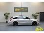 Mercedes-Benz CLA Shooting Brake 180 | AMG | MAGNO-ZILVER | Pano | Navi | Dodehoek | Memory | Elektr Stoel | Multispaak | Elektr klep