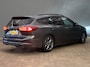 Ford Focus Wagon 1.0 EcoBoost Hybrid ST Line | Trekhaak | Stoel/stuur/voorruit verwarming | Cruise adaptief | Dodehoek detectie | Camera | Apple Carplay/Android Auto | Apple Carplay/Android Auto|telefoonintegratie premium | Cruise control adaptief met Stop&Go en stuurhulp | Dodehoek detectie