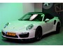 Porsche 911 Cabrio 3.8 Turbo 441kW/600pk PDK7 NL-AUTO!! AKRAPOVIC COMPLEET + SPORT CHRONO + PDLS PLUS + KEYLESS DRIVE + PASM + CAMERA + STOELVERWARMING&-VENTILATIE + BOSE SOUND + TARGET BLUEYE + MOSHAMMER SPOILERPAKKET + PARKSENSOREN V&A + 20" VOSSEN LM-VELGEN!