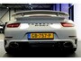 Porsche 911 Cabrio 3.8 Turbo 441kW/600pk PDK7 NL-AUTO!! AKRAPOVIC COMPLEET + SPORT CHRONO + PDLS PLUS + KEYLESS DRIVE + PASM + CAMERA + STOELVERWARMING&-VENTILATIE + BOSE SOUND + TARGET BLUEYE + MOSHAMMER SPOILERPAKKET + PARKSENSOREN V&A + 20" VOSSEN LM-VELGEN!