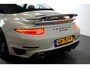 Porsche 911 Cabrio 3.8 Turbo 441kW/600pk PDK7 NL-AUTO!! AKRAPOVIC COMPLEET + SPORT CHRONO + PDLS PLUS + KEYLESS DRIVE + PASM + CAMERA + STOELVERWARMING&-VENTILATIE + BOSE SOUND + TARGET BLUEYE + MOSHAMMER SPOILERPAKKET + PARKSENSOREN V&A + 20" VOSSEN LM-VELGEN!