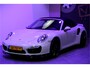 Porsche 911 Cabrio 3.8 Turbo 441kW/600pk PDK7 NL-AUTO!! AKRAPOVIC COMPLEET + SPORT CHRONO + PDLS PLUS + KEYLESS DRIVE + PASM + CAMERA + STOELVERWARMING&-VENTILATIE + BOSE SOUND + TARGET BLUEYE + MOSHAMMER SPOILERPAKKET + PARKSENSOREN V&A + 20" VOSSEN LM-VELGEN!