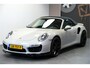 Porsche 911 Cabrio 3.8 Turbo 441kW/600pk PDK7 NL-AUTO!! AKRAPOVIC COMPLEET + SPORT CHRONO + PDLS PLUS + KEYLESS DRIVE + PASM + CAMERA + STOELVERWARMING&-VENTILATIE + BOSE SOUND + TARGET BLUEYE + MOSHAMMER SPOILERPAKKET + PARKSENSOREN V&A + 20" VOSSEN LM-VELGEN!