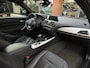 BMW 1-Serie 114i Business+ Leder Navi Parkeersensoren Mistlampen Cruise control 16"L.M.