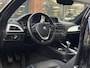 BMW 1-Serie 114i Business+ Leder Navi Parkeersensoren Mistlampen Cruise control 16"L.M.