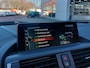 BMW 1-Serie 118i 136pk Automaat High Executive 5-Deurs | Origineel NL | Navi | Clima | Adap.Cruise | Harman-Kardon | Schuifdak | Leder+Sportstoel+Stoelverwarming | Led Koplampen | Pdc V+A+Camera | 16''lm
