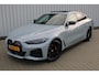 BMW i4 M50 High Executive 84 kWh | Incl. 12 maanden garantie | Assisted driving | Climate control | 360° camera | Uitklapbare trekhaak | Stoel/stuurverwarming | Head-up display | Schuif/kantel dak |