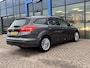 Ford Focus 1.0 Titanium 125PK NIEUWE DISTRIBUTIERIEM!! Voorruitverwarming Climate Cruise Parkeersensoren Navi 17" Velgen *Dealer Onderhouden*