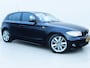 BMW 1-Serie 120i Anniversary | Clima | Cruise | Multimedia/Navi | Leder | Stoelverwarming | PDC |