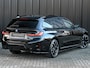 BMW 3-Serie Touring 330e xDrive · M sport · Accu 19,5kWh · Trekhaak · Panoramadak · Active Cruise · Panorama dak · Camera · Ambiance interieur ·