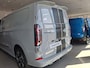 Ford Transit Custom 320 2.5 PHEV L2H1 Sport | 19 INCH VELGEN | INKLAPBARE TREKHAAK | VERWARMBAAR STUURWIEL | CENTRALE DUBBELE VERGRENDELING | PREMIUM LAK: GREY MATTER | ADAPTIVE CRUISE CONTROL | PROGRAMMEERBARE VOERTUIG INTERFACE