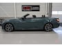 BMW 4-Serie Cabrio 420i High Executive M-Sport Sportstoelen Camera Stoelverwarming Curved dashboard Navigatie Airco-ecc 19 inch Sportvelgen App connect Cape York Green metallic Zwart sportleer