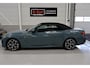 BMW 4-Serie Cabrio 420i High Executive M-Sport Sportstoelen Camera Stoelverwarming Curved dashboard Navigatie Airco-ecc 19 inch Sportvelgen App connect Cape York Green metallic Zwart sportleer