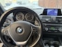 BMW 1-Serie 114i Business+ / SPORT / LEER / SCHUIFDAK / NAVI / STOELVERWARMING