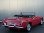 MG MG B Roadster TARTAN RED BJR 1963 94 PK LINKS GESTUURD! | Wire Wheels | PULL-HANDLE DEUREN | LUGGAGE RACK | CHROMEN BUMPERS | ZEER NETTE CONDITIE