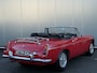 MG MG B Roadster TARTAN RED BJR 1963 94 PK LINKS GESTUURD! | Wire Wheels | PULL-HANDLE DEUREN | LUGGAGE RACK | CHROMEN BUMPERS | ZEER NETTE CONDITIE