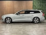 Volvo V60 B4 Plus Dark Trekhaak | Schuifdak | Adaptieve Cruise Control | Stoelverwarming voor+achter | Stuurwielverwarming | Full LED Meesturende koplampen | Pilot Assist | BLIS Dode Hoek Detectie | Parkeercamera | Elektrische voorstoelen geheugen | Lederen bekleding | Zitting verlenging voorstoelen | 18 Inch | Google Infotainment | Keyless Drive | Privacy Glass | Parkeersensoren voor+achter | Breedstralers in voorbumper | Elektrisch bedienbare achterklep | DAB Radio | Apple Carplay/Android Auto | Draadloos telefoon opladen | Volvo On Call met mobiele App functie | Vapour Grey Metallic |