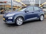 Hyundai Kona Electric EV Comfort 64 kWh | SOH: nnb | 3 Fase | Warmtepomp | Trekhaak | Navi | Adaptive CC | Climate |