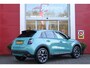 Fiat 600 1.2 HYbrid 110PK LA PRIMA | ELEKTRISCH VERSTELBARE BESTUURDERSTOEL MET MASSAGEFUNCTIE | NAVIGATIE | DODEHOEK DETECTIE | ELEKTRISCHE ACHTERKLEP | LEDKOPLAMPEN-MISTLAMPEN | LED ACHTERLICHTEN | PACK COMFORT: ACHTERUITRIJCAMERA / PARKEERSENSOREN VOOR-ACHTER / DRAADLOOS TELEFOONLADEN / DRAADLOOS APPLE CARPLAY - ANDROID AUTO / KEYLESS ENTRY-START / AUDIOSYSTEEM MET 6 SPEAKERS | WINTER PACK: VERWARMBARE VOORSTOELEN / VERWARMBARE VOORSTOELEN | 18"LICHTMETALEN VELGEN TWO-TONE | EXTRA GETINTE ACHTERRUITEN | CLIMATE CONTROL |