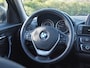 BMW 1-Serie 118i Business+ | Panoramadak | Cruise Control | Parkeersensoren | Sportstoelen |