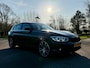 BMW 1-Serie 118i Centennial Executive | Navi | 18" Velgen | Clima | 6 Versnellingen | PDC | Cruise | LED | extra winterset! |