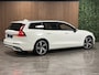 Volvo V60 T6 AWD Recharge R-Design Trekhaak | Adaptieve Cruise Control | Stoel en Stuurwielverwarming | Parkeercamera | Full LED Meesturende koplampen | Pilot Assist | BLIS Dode Hoek Detectie | Bestuurdersstoel elektrisch geheugen | Contour stoelen met wit stiksel en bies | Zitting verlenging voorstoelen | 19 Inch | Keyless Drive | Parkeersensoren voor+achter | Privacy Glass | Elektrisch bedienbare achterklep | DAB Radio | Apple Carplay/Android Auto | Volvo On Call met mobiele App functie |