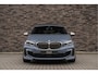BMW 1-Serie M135i xDrive | Live Cockpit | Panorama | Schaalstoelen | Memory | H&K | Head-Up | 19"LM | Storm Bay Metallic