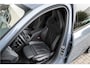 BMW 1-Serie M135i xDrive | Live Cockpit | Panorama | Schaalstoelen | Memory | H&K | Head-Up | 19"LM | Storm Bay Metallic