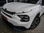 Citroën E-C4 Shine 50 kWh | Keyless entry en start | 18 inch lichtmetalen velgen | Achteruitrijcamera | Adaptive cruise control | Head up display | Climate control | Extra getint glas