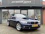 BMW 1-Serie 116d Centennial High Executive ✅ Stoelverwarming ✅ Navi ✅ Cruise ✅ PDC V+A ✅