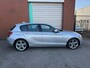 BMW 1-Serie 118i Upgrade Edition automaat NAV.+ Airco Bj:2012 NAP!