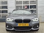 BMW 1-Serie 120i High Executive | Navigatie/Carplay | LM Velgen 18" | Voorstoelen Verwarmd | Cruise Control | Lederen Bekleding | Achteruitrijcamera | Airco |
