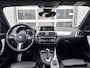 BMW 1-Serie 120i High Executive | Navigatie/Carplay | LM Velgen 18" | Voorstoelen Verwarmd | Cruise Control | Lederen Bekleding | Achteruitrijcamera | Airco |